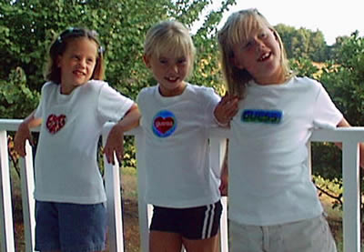 Picture of Three Girls Wearing Liquid-Filled Bubble Patch T-Shirts by Guess?